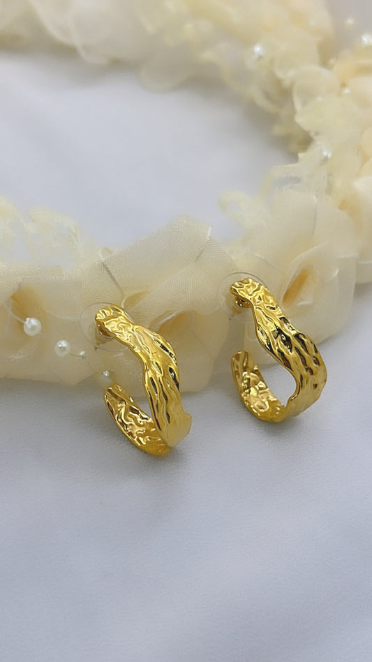 Boucle d'oreille chassée